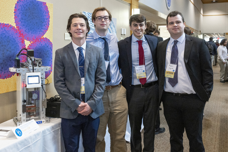 Sponsors from UD’s Center for Clean Hydrogen challenged the 2025 student team to finalize the design of a conductivity-measuring device. “The Enforcer,” developed by Luke Dosen,  Benjamin Nevling, Steven Giorgi and Ryan Logullo, demonstrates how electrical resistance in a porous transport layer (a material used in fuel cells) levels off as pressure increases.