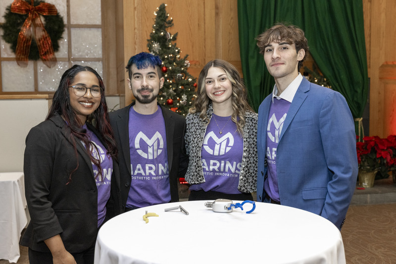 Christy Chacko, Logan Feiler, Elaine Kachala and Conlon Stasium presented their proposed improvements to the “fingers” of a hook-style prosthetic hand at the Dec. 11 event.