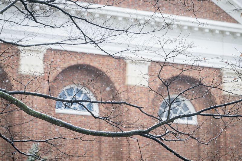 Snow begins to fall outside of Mitchell Hall on the University’s Newark Campus in December 2025.