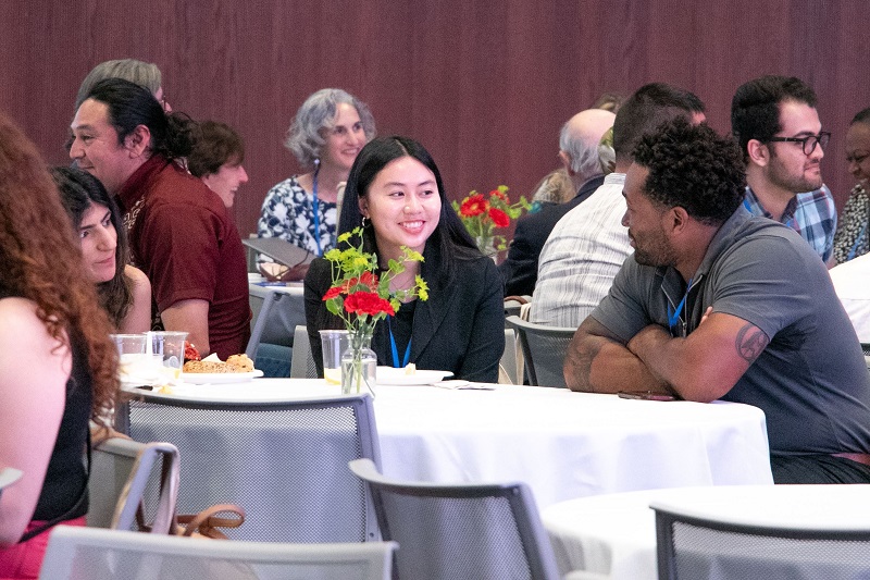 Faculty mentors and graduate student participants discuss their research and professional experiences at the conference.