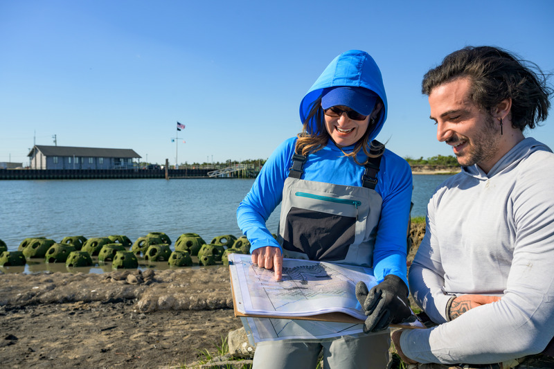 Jules Bruck (left) said the UD landscape architecture students are trying innovative designs and will monitor progress, working toward a goal of decreased erosion and increased sedimentation and habitat. Bruck was a professor and founding director of the landscape architecture program at UD. 