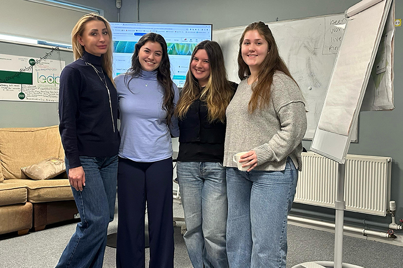At the University of Limerick, honors nursing majors Emma Holleran, Kim Steinberg and Aoife Riordan worked with a University of Limerick educator (left) on lesson plans and developed games to help teach English to Ukrainian refugees. 