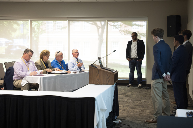 Seniors presented building and design plans to an industry review panel during the Research and Innovation Showcase, gaining feedback from construction professionals.