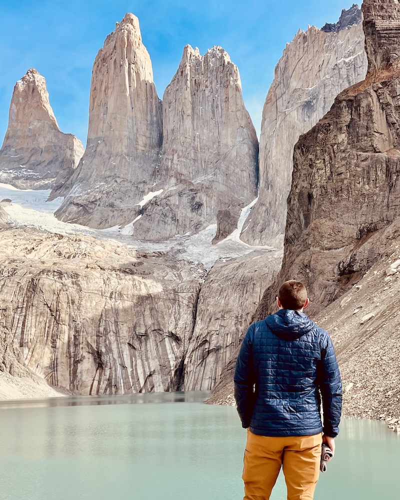 Bennett at the base of the Towers hike in Torres del Paine, Patagonia, which leads to a turquoise glacial lagoon.