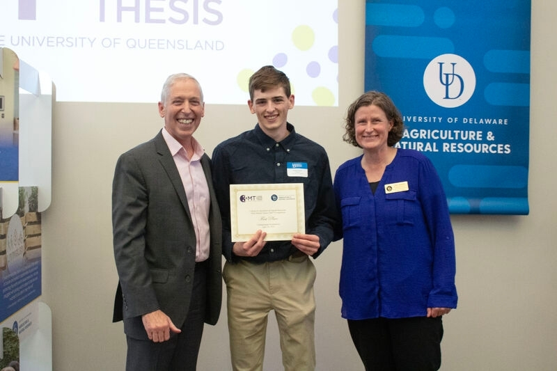 Romano poses for a photo with College of Agriculture and Natural Resources (CANR) Dean Brian Farkas and Associate Dean Tanya Gressley at the 2025 UD CANR Three Minute Thesis Challenge, where he was awarded first place in the undergraduate category. 