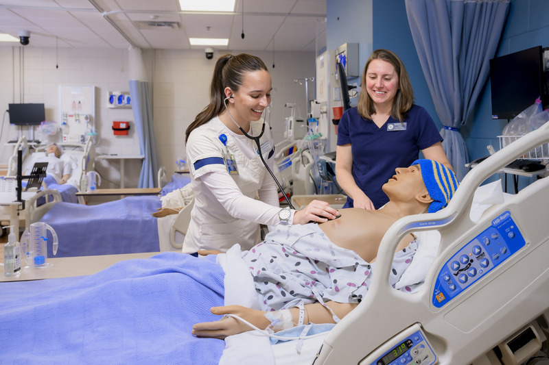 DAISY Award winners in action: Madison Wirchansky (left) hones her skills on a high-fidelity manikin as Assistant Professor of Nursing Michelle DePhillips observes in UD’s Simulation Lab in McDowell Hall.