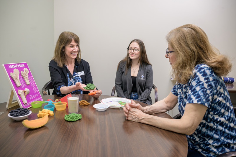 Belinda Pollinger (right) worked with Talia Spitelle (center), a graduate student assistant in the clinic, pursuing her master’s in human nutrition, and Sharon Collison (left), a licensed registered dietitian at UD’s Nutrition Clinic, and learned that food was her medicine. Collison worked with Pollinger to adjust her diet to increase her intake of calories, protein and essential nutrients.