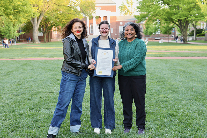 Thanks to the efforts of UD students in ENSC/ENVR 450 Proseminar in the Environment, a senior capstone course, Gov. Matt Meyer signed an official proclamation declaring May 18-22, 2026, as “Delaware Heat Awareness Week.” Pictured from left to right are Shweta Arya, vice president of the Mid-Atlantic Alliance for Climate and Health, who served as the community collaborator; Vaishnavi Tripuraneni, who taught the UD students’ capstone course; and Nora Lucas, Doctoral student and the teaching assistant of the capstone course. 