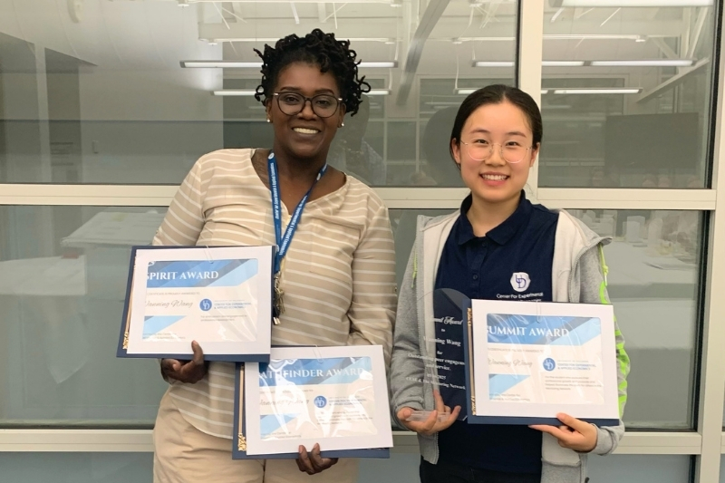University of Delaware senior statistics major Wanning Wang received three awards for her contributions to UD’s Center for Experimental and Applied Economics (CEAE). Wang says working with research manager Aisha Emory (left) was an education in itself. 