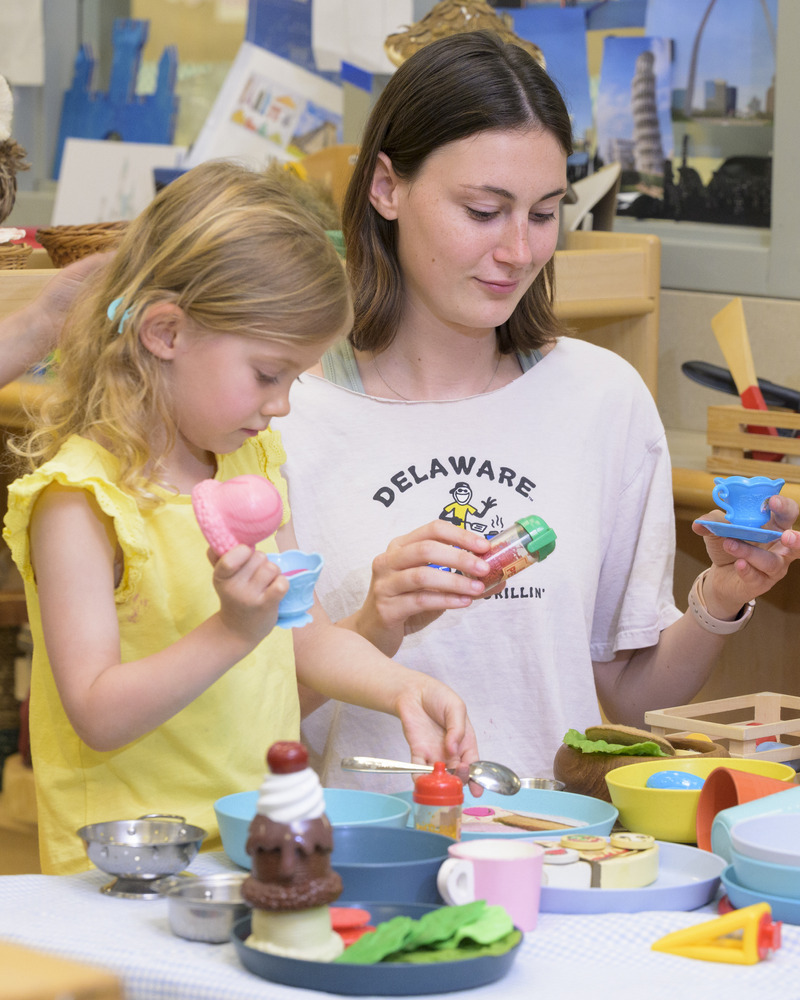 A UD education student plays with a preschooler at the Lab School.