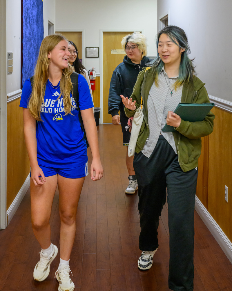 Zanders (left) works on a project in class with other A-UD students.