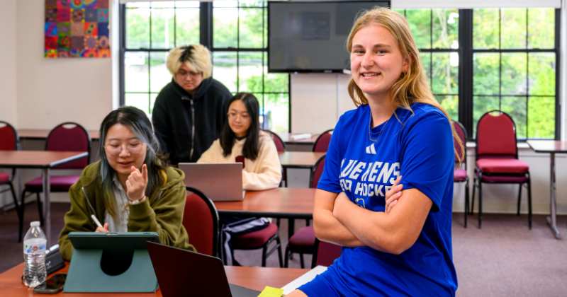 Juulke Zanders, a field hockey player from the Netherlands, smiles in her A-UD class with other international students.
