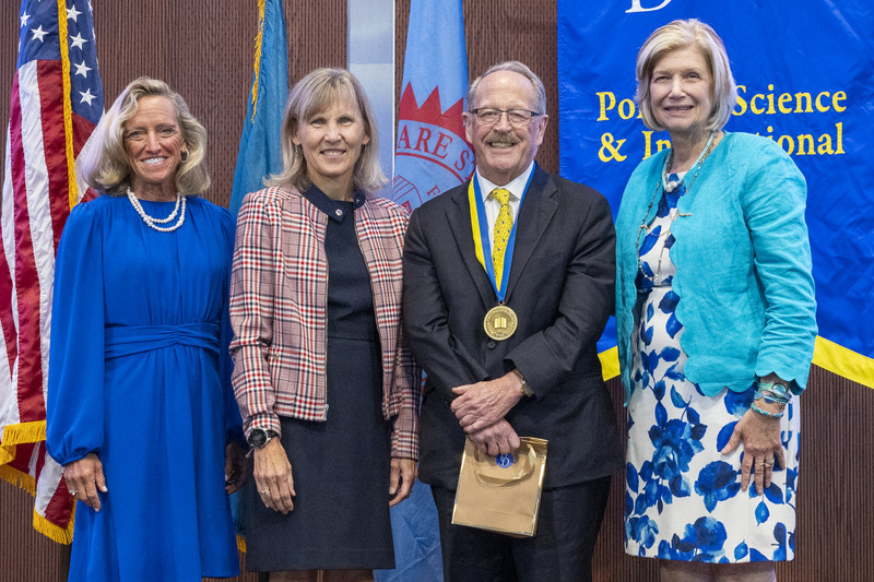 UD alumnus Ray Jacobsen received the University’s Medal of Distinction from the Board of Trustees at the beginning of the event. He is pictured here with UD Trustee Claire DeMatteis (left), Carlson and Trustee Debbie Hess Norris (right). A  student of Jim Soles, Jacobsen was honored for his work in creating mentorship programs, funding internships and career experiences, and serving on multiple UD councils. 