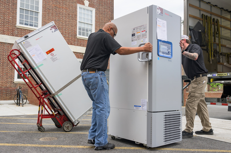 A new, more energy-efficient freezer is delivered to Melinda Duncan’s laboratory. The freezer is one of more than 120 cold storage units purchased with funding from Energize Delaware through an equipment upgrade program through Thermo Fisher Scientific. 