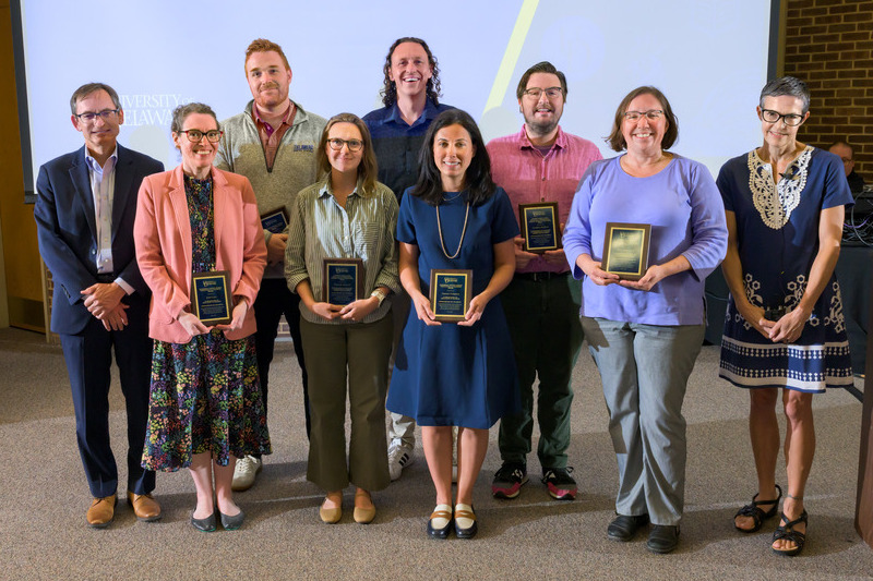 The University of Delaware’s 2026 Excellence in Teaching, and the Excellence in Undergraduate Advising and Mentoring honorees were honored by Interim Provost William Farquar ( left to right back row), Tyler van Buren, Bradley Pitcher, Lochlan Belford, (left to right front row) Jane Case, Amanda Seiwell, Ioanna Fampiou, Erin Brannick and Meghan McInnis-Dominguez, Faculty Senate President, at the Faculty Senate’s inaugural meeting on Sept. 14.