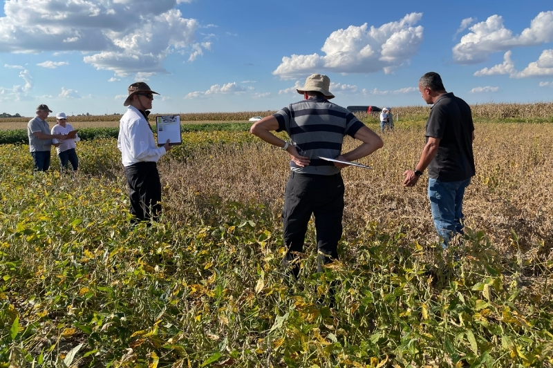 Cornelius works with farmers to collect field data. 
