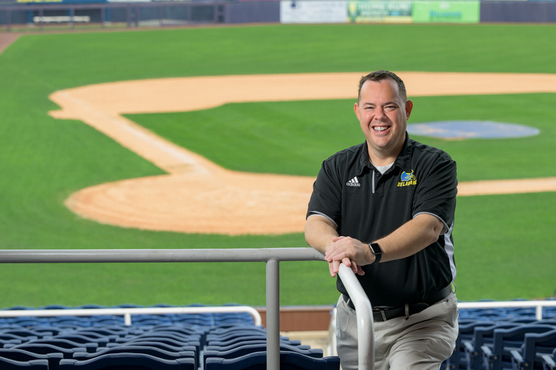 UD alumnus Kevin Linton works as the director of business development for the Wilmington Blue Rocks baseball team, while serving as the Public Address (PA) announcer for UD’s football and basketball teams. Linton said he always dreamed of working in sports and his time at UD helped set him on a successful career path. 