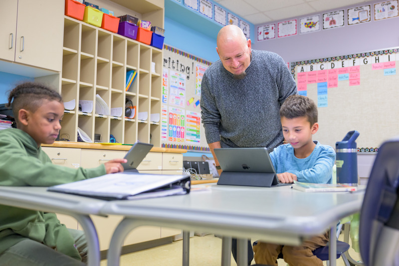 In Delaware, more than 11% of all K-12 students speak Spanish, Chinese, Haitian Creole or another language at home. Here, James Davis, master teacher at The College School, guides elementary students in an activity. 