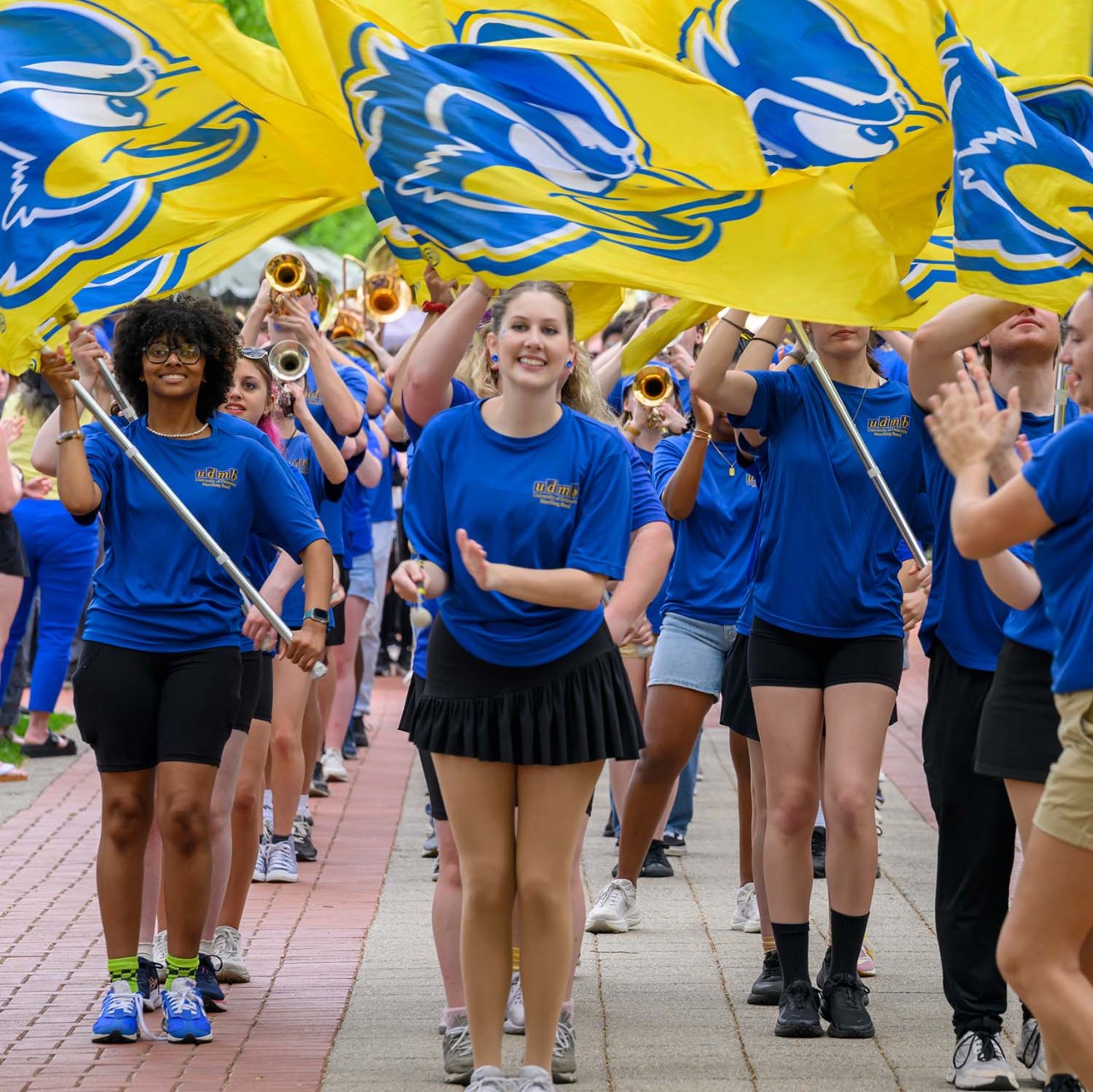 Members of the University of Delaware Marching Band and Spirit Team march in the Opening Procession.