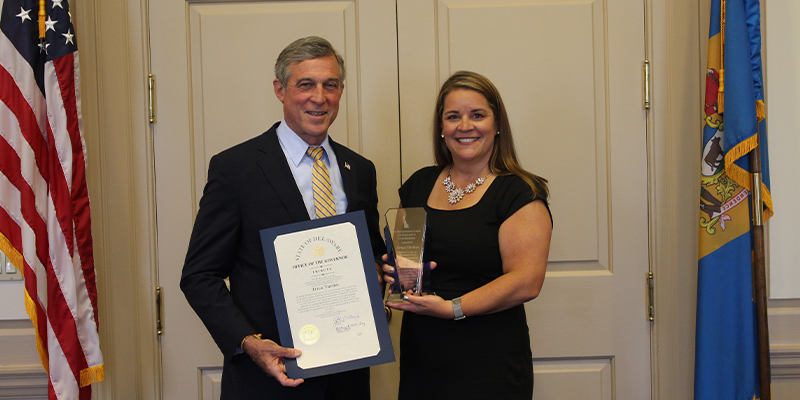 Erica Varites poses for a photo with former Delaware Governor John Carney
