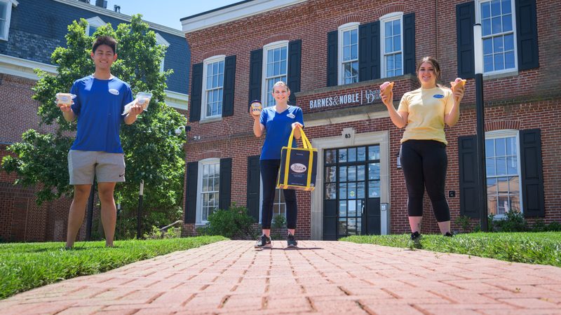 Three students standing in front of the Creamery Cafe