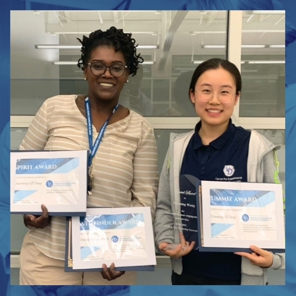 Wanning Wang holding her awards.