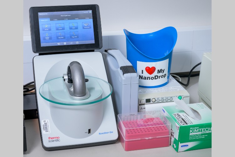 A Thermo Nanodrop One and related equipment sitting in a lab.