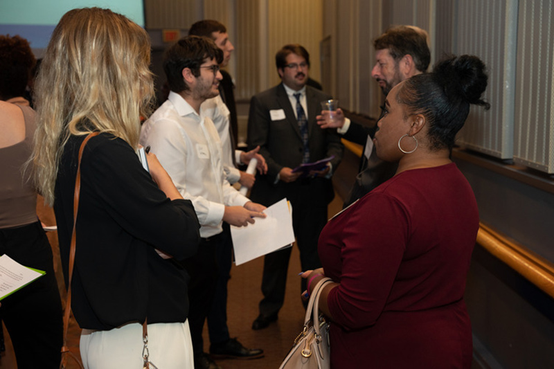 Group of students in professional attire networking