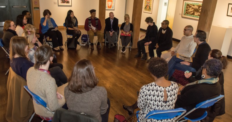 Students sitting in chairs in a circle