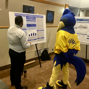 Student presenting his research at Biology Research Day, 2023