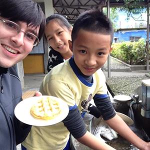 Matthew Werth photo with two of his students