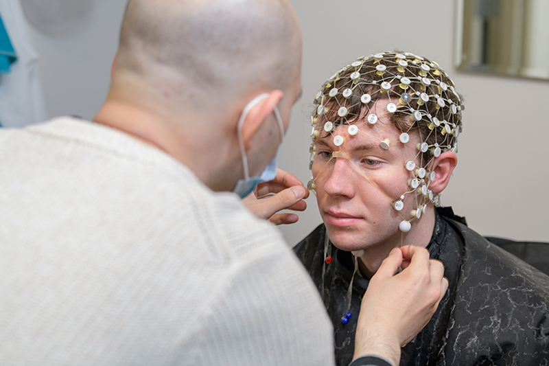 Researchers and research subjects working in the Linguistics and Cognitive Science labs at 800 Barksdale Road.