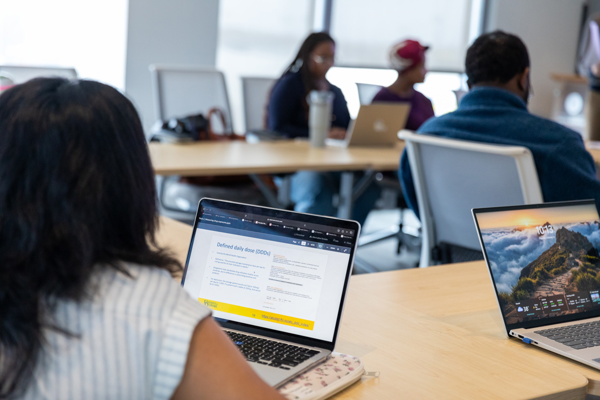 Photo of students in class taking notes on their computers