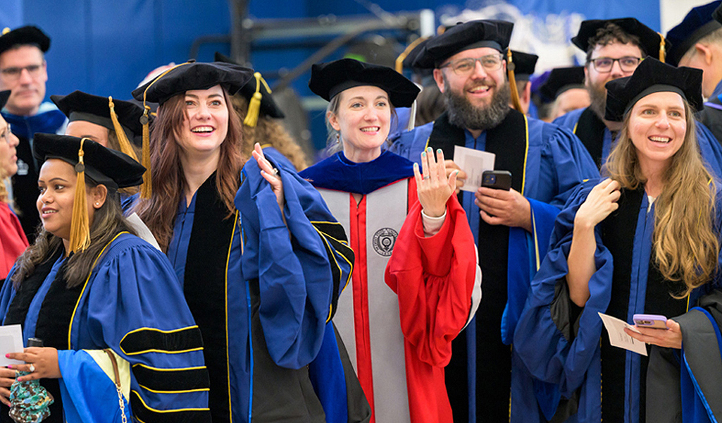 Graduates at doctoral hooding