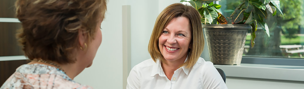 A clinical health coach in conversation with a client.