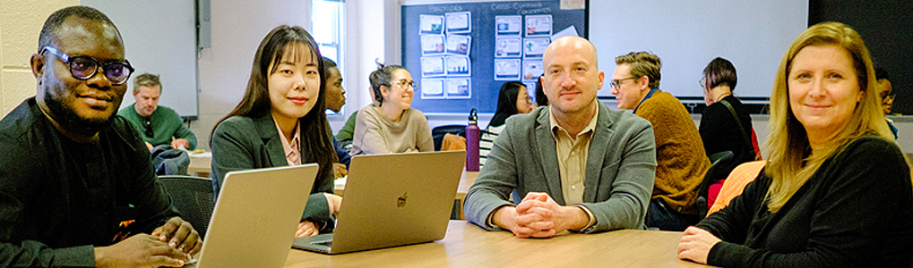 doctoral students John Oluwadero and Hojung Lee meet with School of Education professor Kenneth A. Shores and Laura Desimone, the L. Sandra and Bruce L. Hammonds Professor in Teacher Education and director of research in the College of Education and Human Development. 