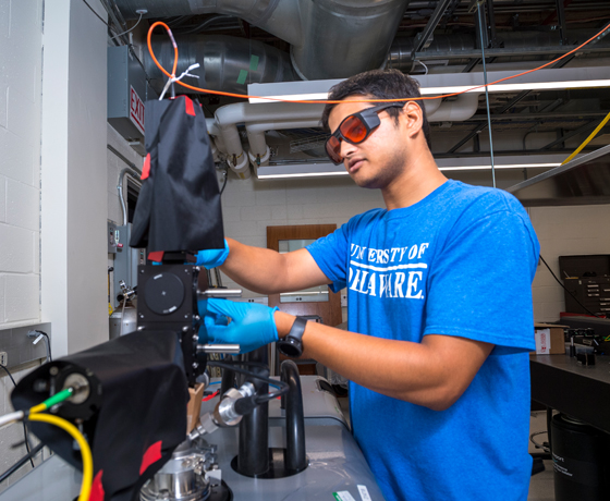 Student performing experiment.