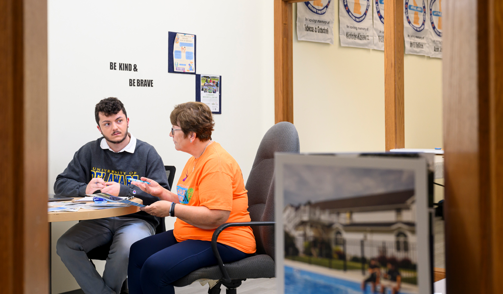 Student and advisor in discussion in an office