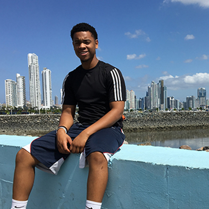 Gilman Scholar Julian Jackson sits overlooking a cityscape.