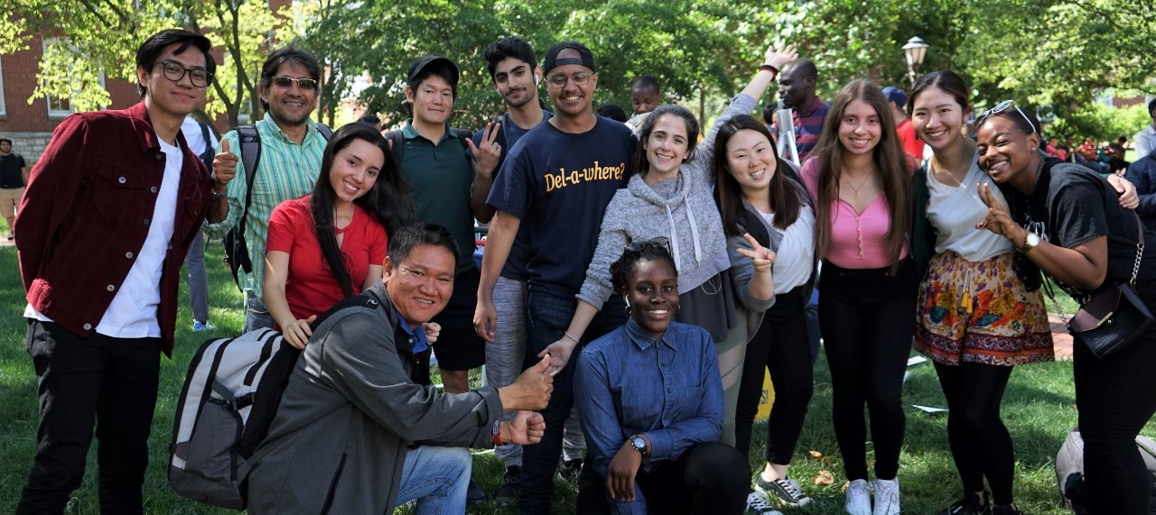 Students pose at UD's Ice Cream Social for international students.