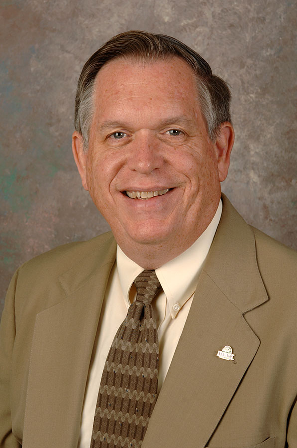 Former Director Douglas F. Tuttle