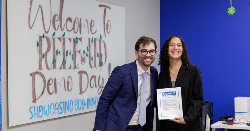 Dr. Salguiero with REEF finalist Alanna Hill in front of the classroom