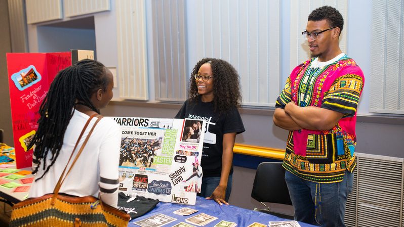 Students speak with each other at the CPAB Block Party