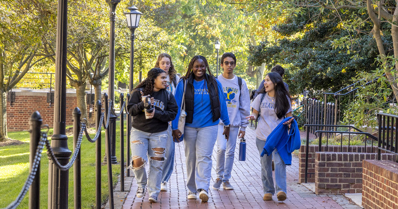 Five students walking to class together