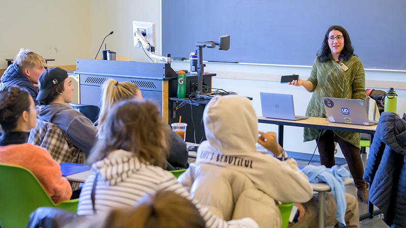 Student Life staff instructs a classroom of students
