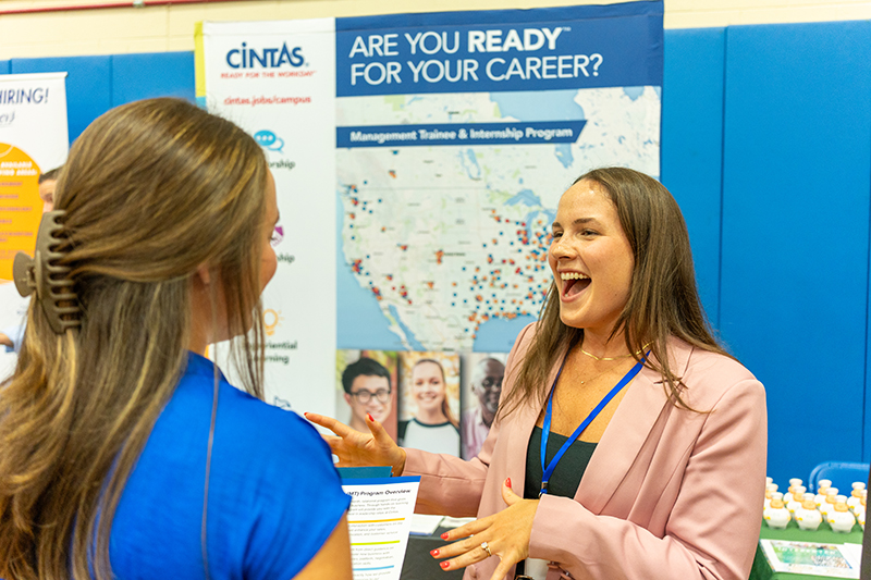 Student speaks with employer at a Career Fair