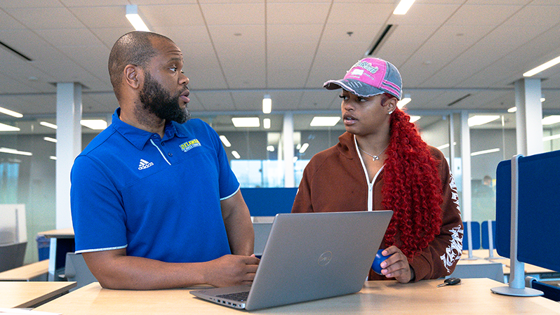 Student-athlete consults with SSA staff