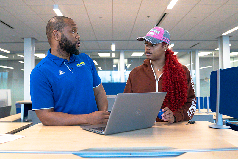Female student receives tutoring from SSA staff