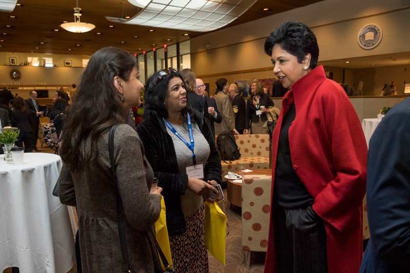 The Weinberg Center breakfast before the event begins with group photos and networking. Group photos taken with President Dennis Assanis, John Pelseko, Myron Steele and Indra Nooyi. (Signage was posted around the event.)