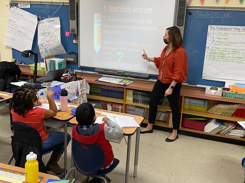Khristina McDowell, a second-grade teacher at Blades Elementary School, engages in a Bookworms lesson with her students.